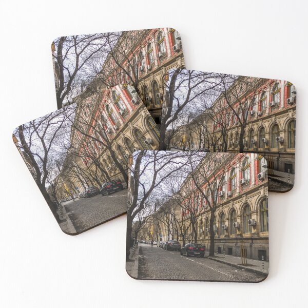 Item preview, Cobbled street with buildings and leafless trees designed and sold by Mel Moreno.