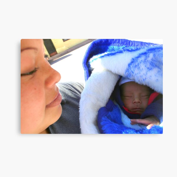 Keeping Watch on Her Sleeping Babe Canvas Print