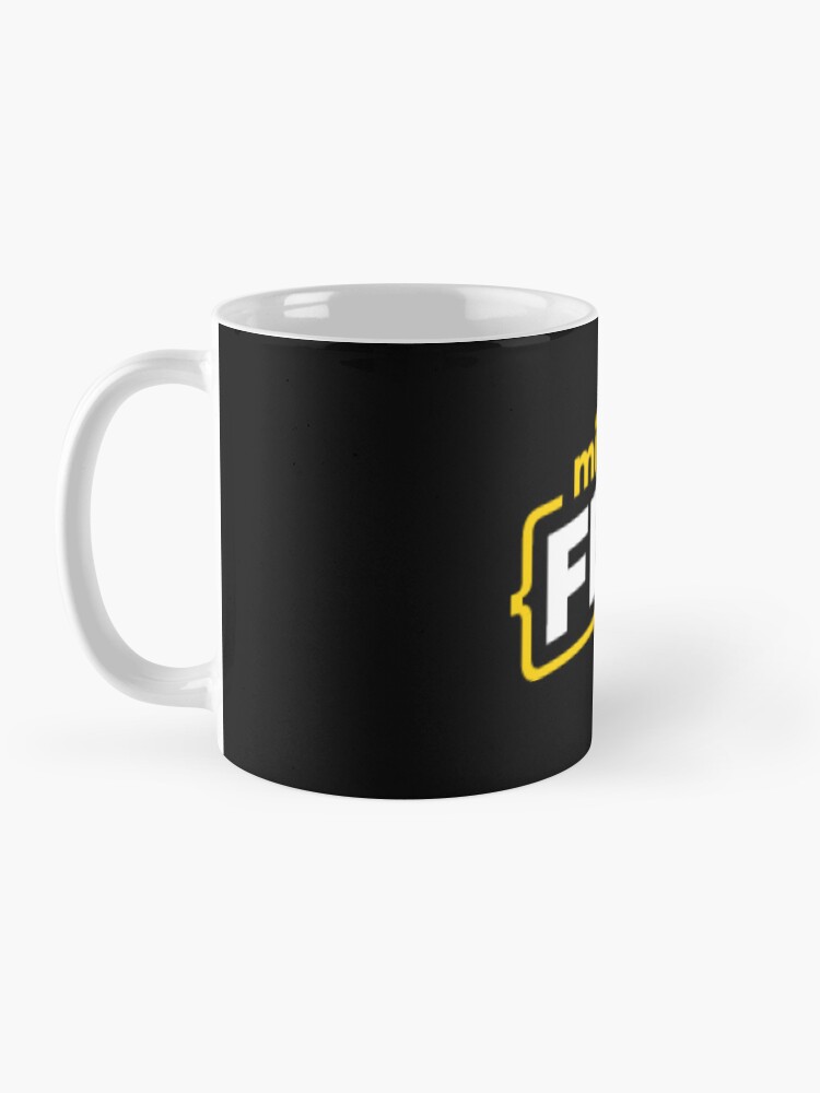 Imagen 3 de 6, Taza de café con la obra MiduFest, diseñada y vendida por midu-dev.
