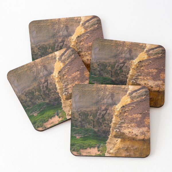 Item preview, Vibrant orange coastline contrasting with lush green bushes on Great Ocean Road, Australia designed and sold by TRex-Landscapes.