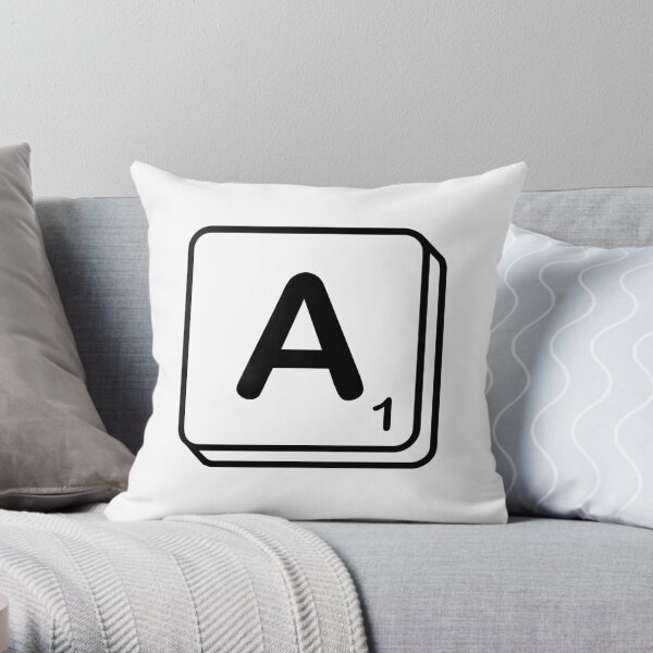 A scrabble print Throw Pillow