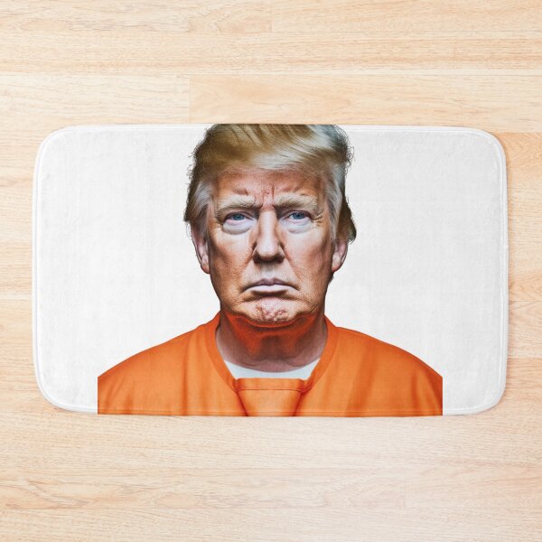 Item preview, Donald Trump’s mugshot in an orange jumpsuit. full color hyper realistic photo with High definition detail, over head fluorescent lighting, white background designed and sold by OnlyShowers.