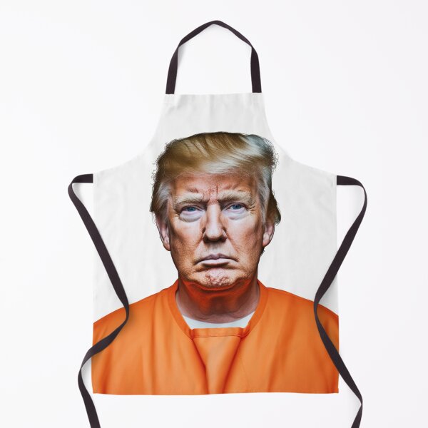 Item preview, Donald Trump’s mugshot in an orange jumpsuit. full color hyper realistic photo with High definition detail, over head fluorescent lighting, white background designed and sold by OnlyShowers.