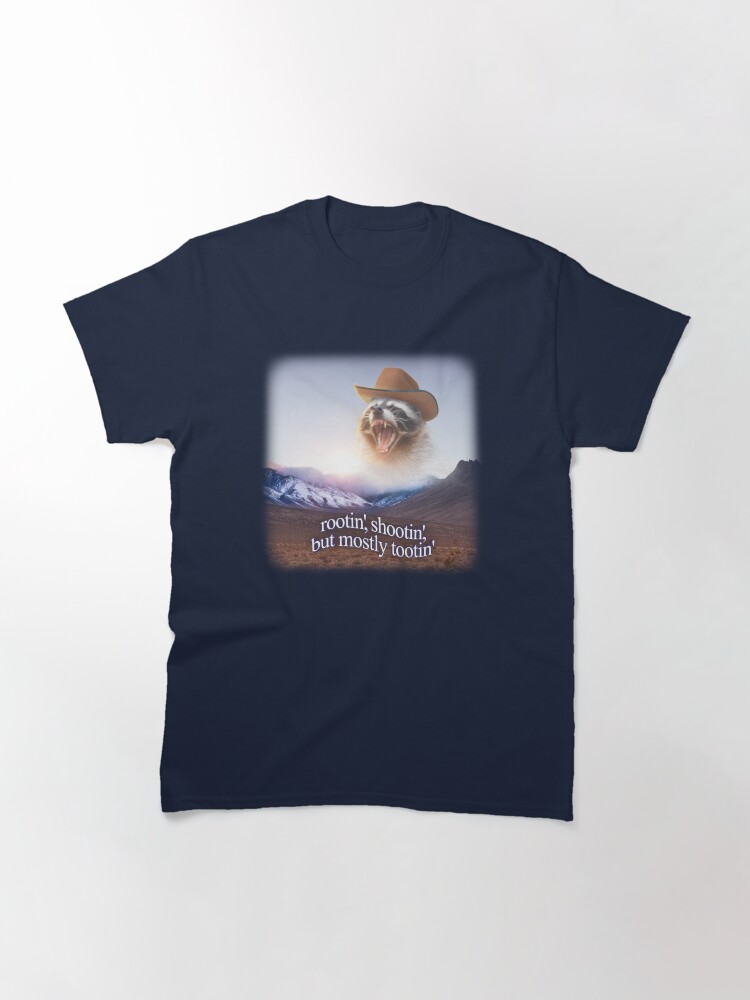Imagen 3 de 7, Camiseta clásica con la obra rootin shootin pero sobre todo tootin vaquero mapache arte de la palabra, diseñada y vendida por snazzyseagull.