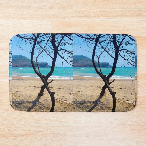 Item preview, Vertical view through two curved pine tree trunks to a sand beach designed and sold by kall3bu.