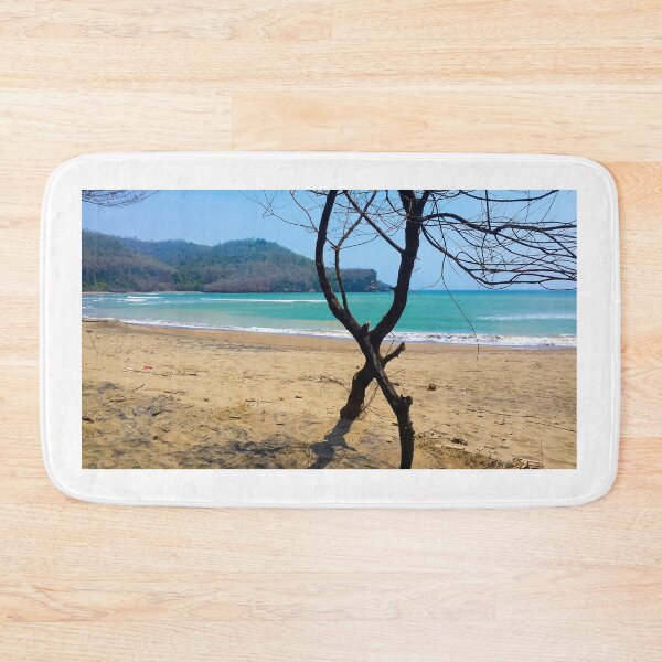 Item preview, View through two curved pine tree trunks to a sand beach designed and sold by kall3bu.