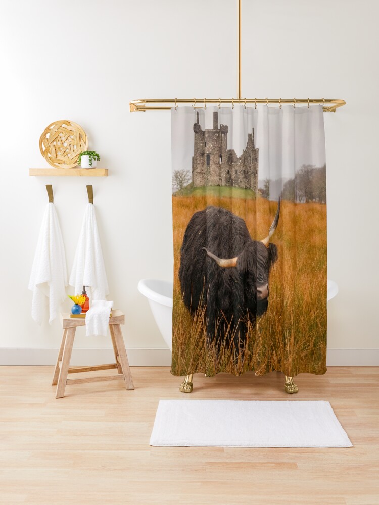 Shower Curtain, Kilchurn Castle being guarded by a highland cow! designed and sold by Hike-and-Click