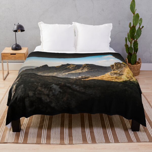 The Cobbler Throw Blanket