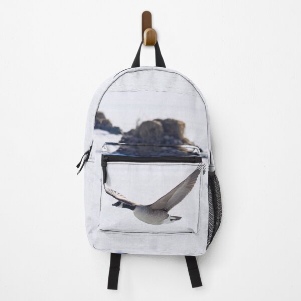 Item preview, Canada goose flying over icy lake designed and sold by Jouko Lehto Photography.