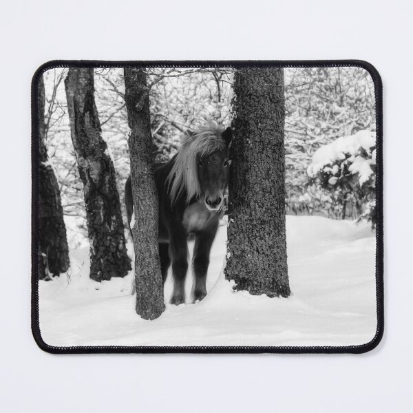 Item preview, Chestnut Horse Between Trees in Snowy Winter Landscape - Black & White designed and sold by Nicklas81.