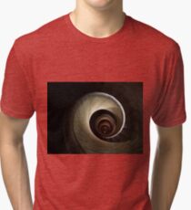 A top view of a spiral staircase that goes down, spiraling along the walls of an endless circular tunnel Tri-blend T-Shirt