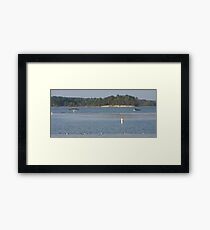 Boats on a lake Framed Print