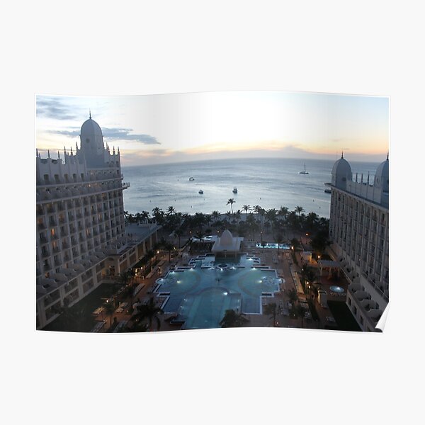  Riu Palace Aruba, evening time, pink clouds, empty water pool, palm trees on the beach, darkness and nigh light Poster