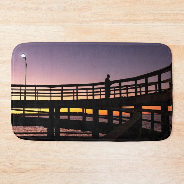 Item preview, A man fishing on the docks in Punta del Este, Uruguay, while the sun sets. Color digital backlit photography during twilight. designed and sold by nachodramis.