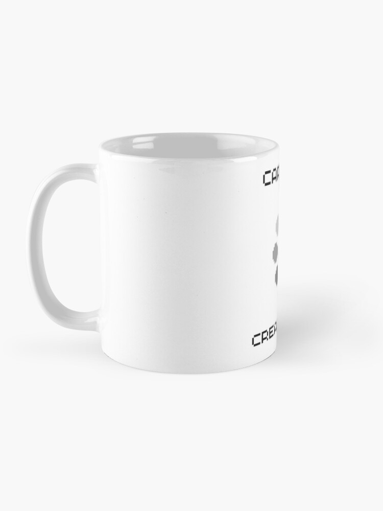 Imagen 3 de 6, Taza de café con la obra Cargando creatividad, diseñada y vendida por SaraPanacea.
