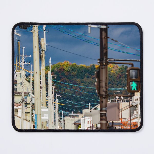 Item preview, Illuminated hilltop with dark clouds through a city street designed and sold by Shizenkai.