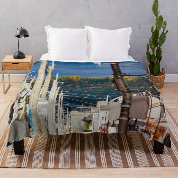 Item preview, Illuminated hilltop with dark clouds through a city street designed and sold by Shizenkai.