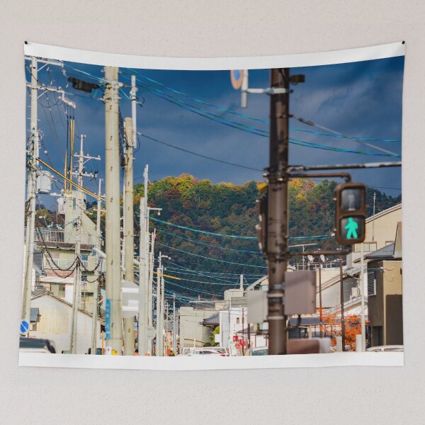 Item preview, Illuminated hilltop with dark clouds through a city street designed and sold by Shizenkai.