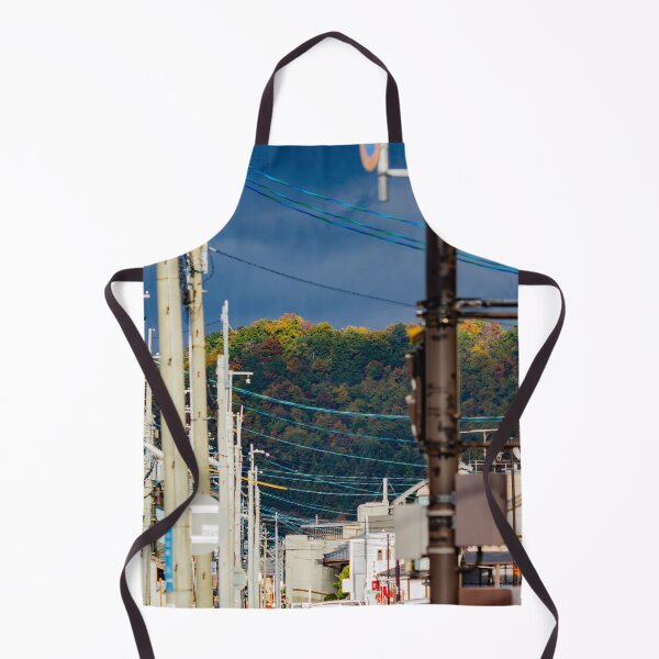 Item preview, Illuminated hilltop with dark clouds through a city street designed and sold by Shizenkai.