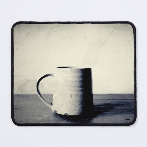 Tasse kaffee auf einem Tisch Mauspad