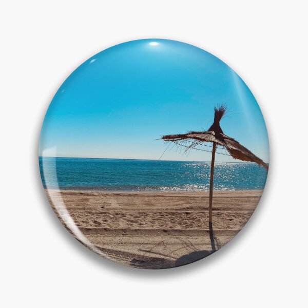 Item preview, Beach umbrella under the sunlights reflection on blue water  designed and sold by Donutlovers.