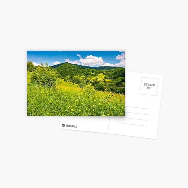 grassy fields in mountainous rural area Postcard