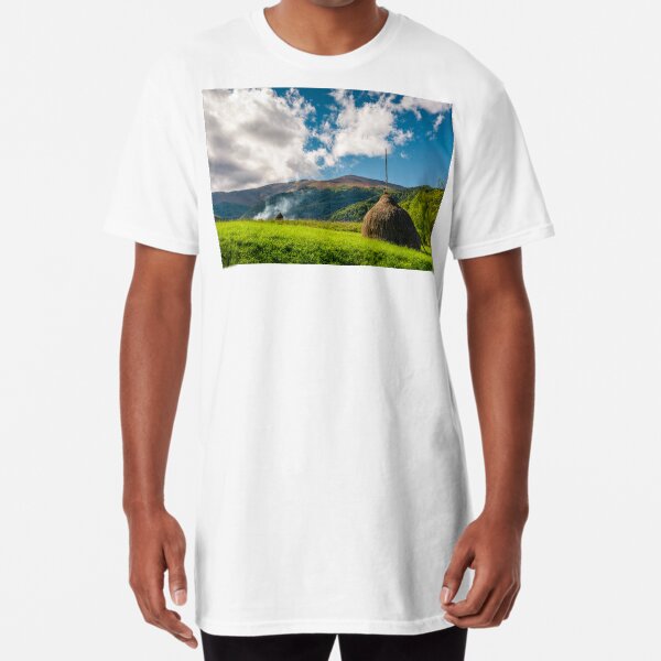 haystacks in a field near the forest and mountain Long T-Shirt