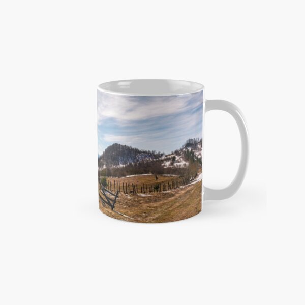 spruce trees near the fence on hillside Classic Mug