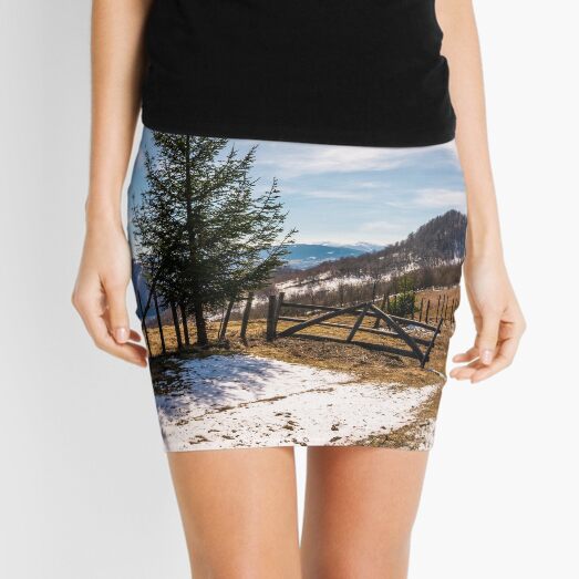 spruce trees near the fence on hillside Mini Skirt