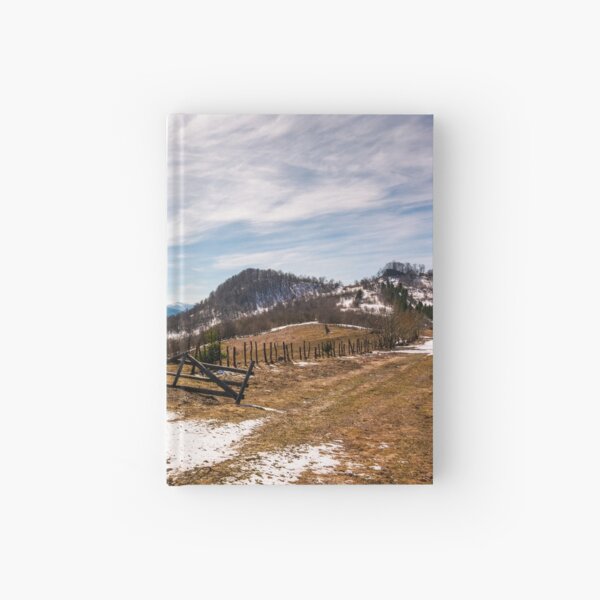 spruce trees near the fence on hillside Hardcover Journal
