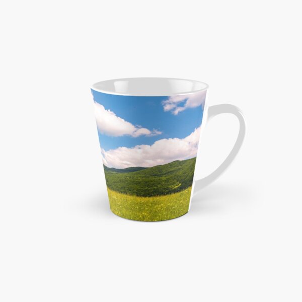 haystack on a grassy pasture in mountains Tall Mug