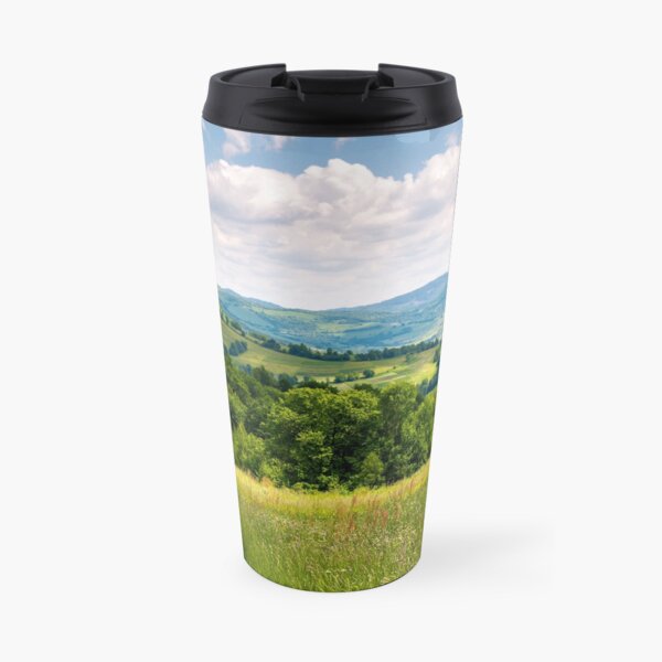 grassy fields in mountainous rural area Travel Mug