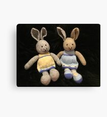 Knitted girl rabbits Canvas Print