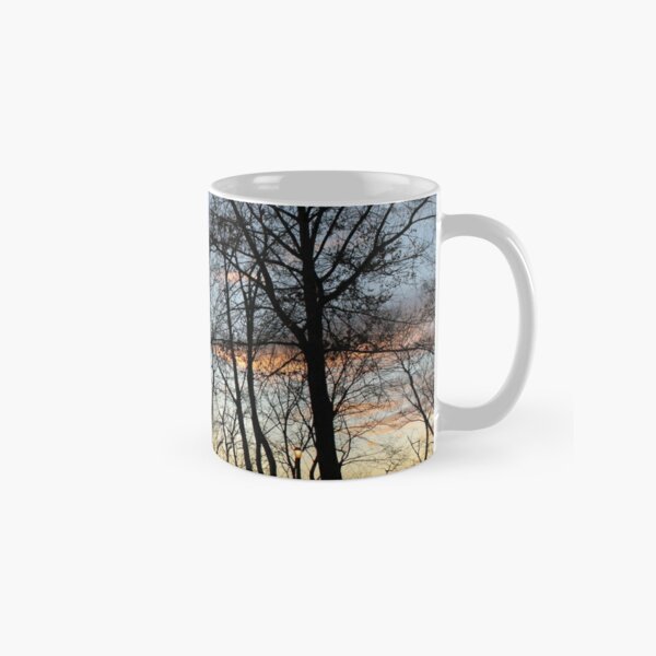 Sunset, pink clouds, trees, tree branches dance strange dance in the rays of sunset Classic Mug