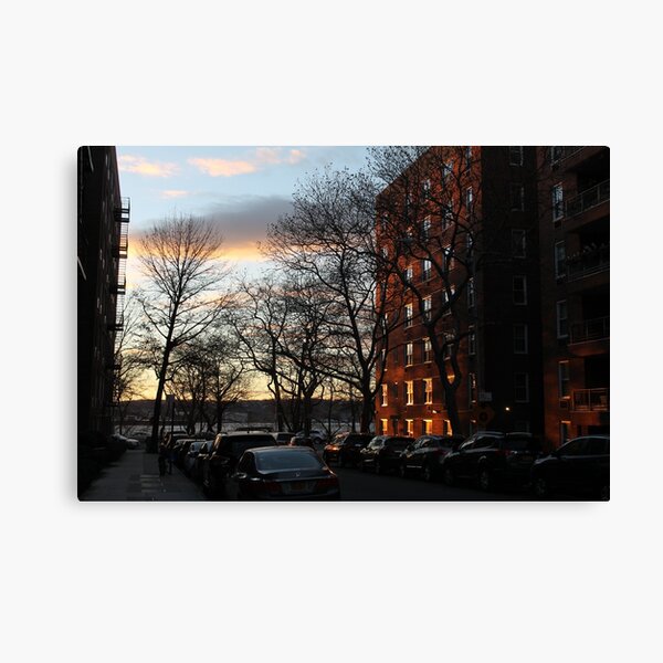 Evening, sunset, evening glow, the rays of the setting sun in the Windows, pink clouds Canvas Print