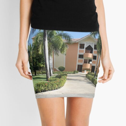 A house surrounded by large palms Mini Skirt