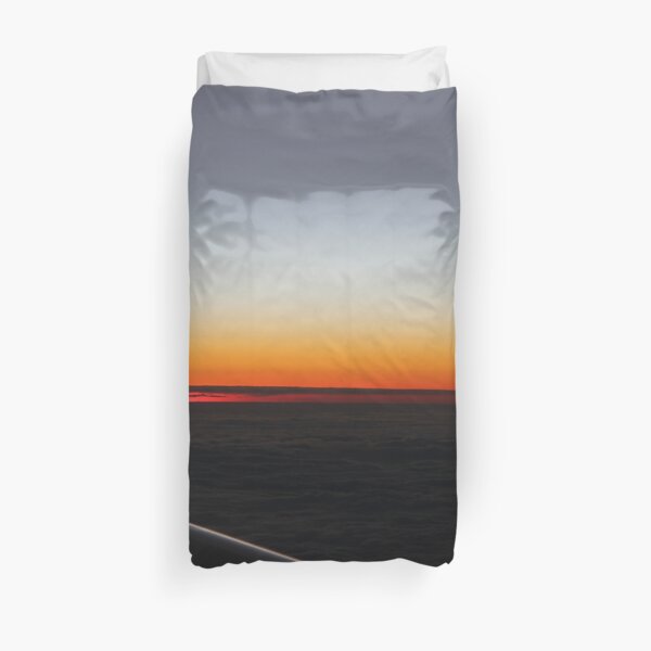 Setting sun, evening dawn, pink clouds, side, plane Duvet Cover