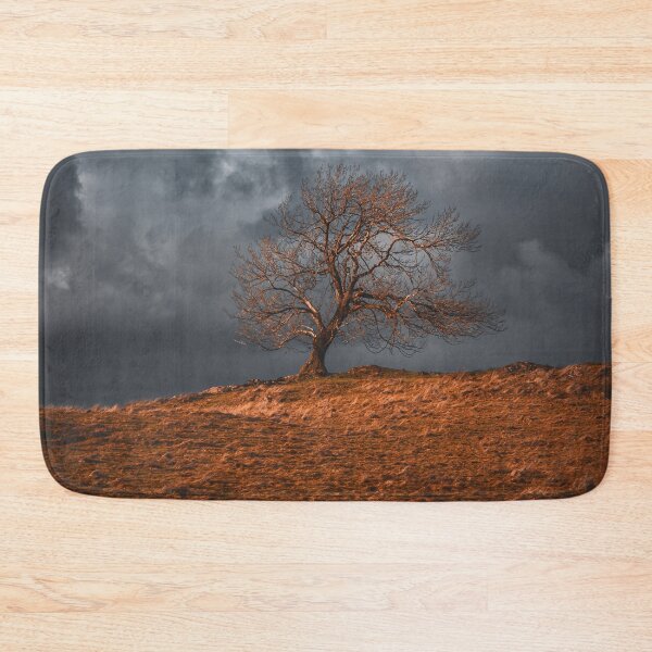 Item preview, Dramatic firey tree on a stormy winter sky in the Lake District designed and sold by chiaravisuals.