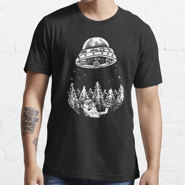 UFO buzzes Yeti in the forest Essential T-Shirt