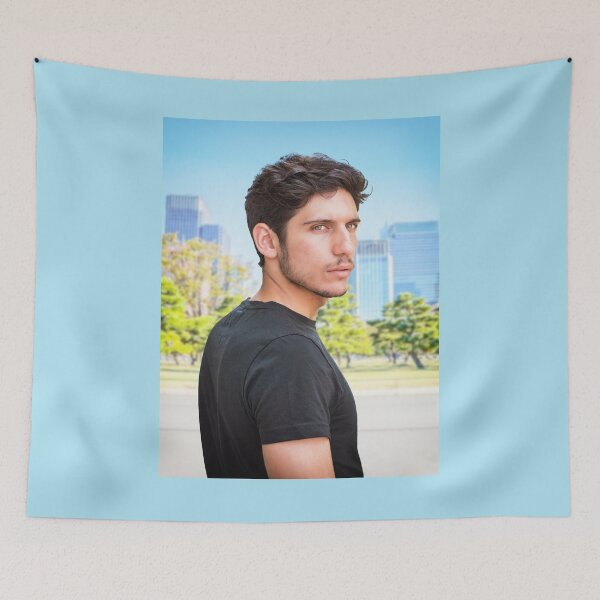 Item preview, Head and shoulders shot of one handsome young man with green eyes in urban setting, looking at camera, wearing t-shirt designed and sold by Mercurius-M.