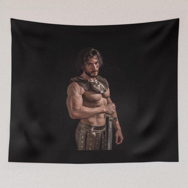 Item preview, Handsome muscular man posing shirtless in roman or spartan gladiator costume on black. designed and sold by Mercurius-M.