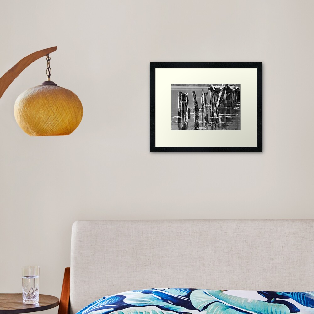 Broken jetty poles Framed Art Print