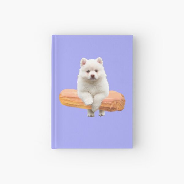 Cute Alaskan Malamute Dog jumping an éclair by Alice Monber Hardcover Journal