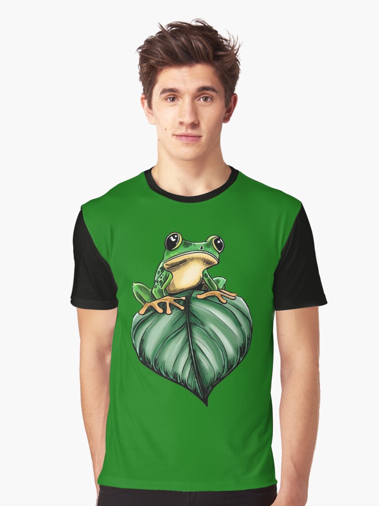 Thumbnail 1 of 5, Graphic T-Shirt, Frog flying on a leaf designed and sold by GroundhogMs.