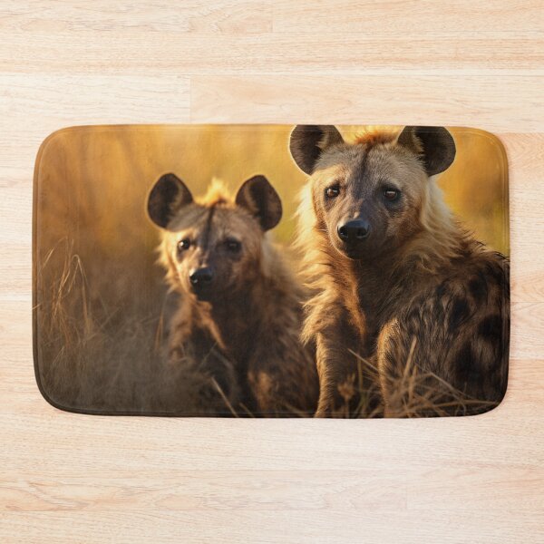 Item preview, Two hyenas sit side by side in the grass designed and sold by isBotStore.