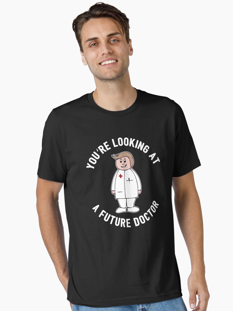 Thumbnail 1 of 7, Essential T-Shirt, You're Looking At A Future Doctor - Funny Medical Student Quote Gift designed and sold by yeoys.