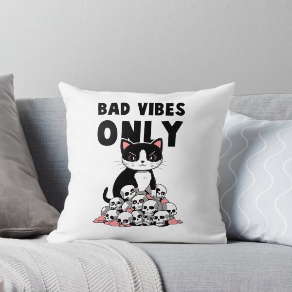 Item preview, Black cat sits below a pile of skulls Saying bad vibes only, in the style of bold graphic illustrations, cute cartoonish designs, optical illusion designed and sold by SE7VENTH.