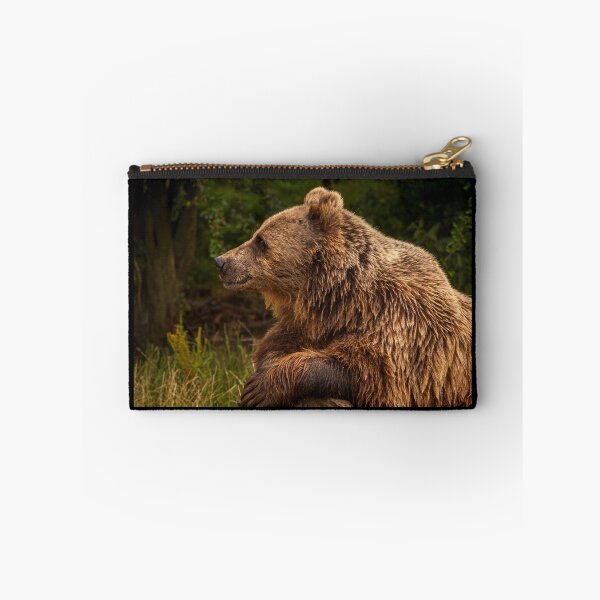 Item preview, Portrait of content brown bear resting on a log designed and sold by bailey-cooper.