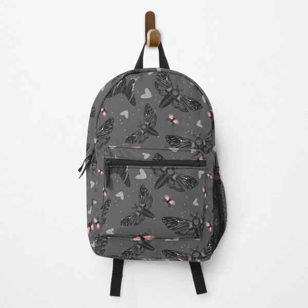 Pattern of fluttering moths on dark grey background Backpack
