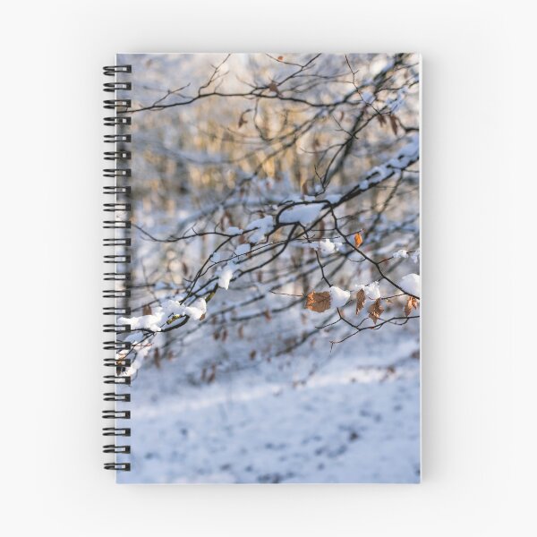 Item preview, Snowy woodland with branches with Beech Leaves hanging on designed and sold by Susan Reilly.